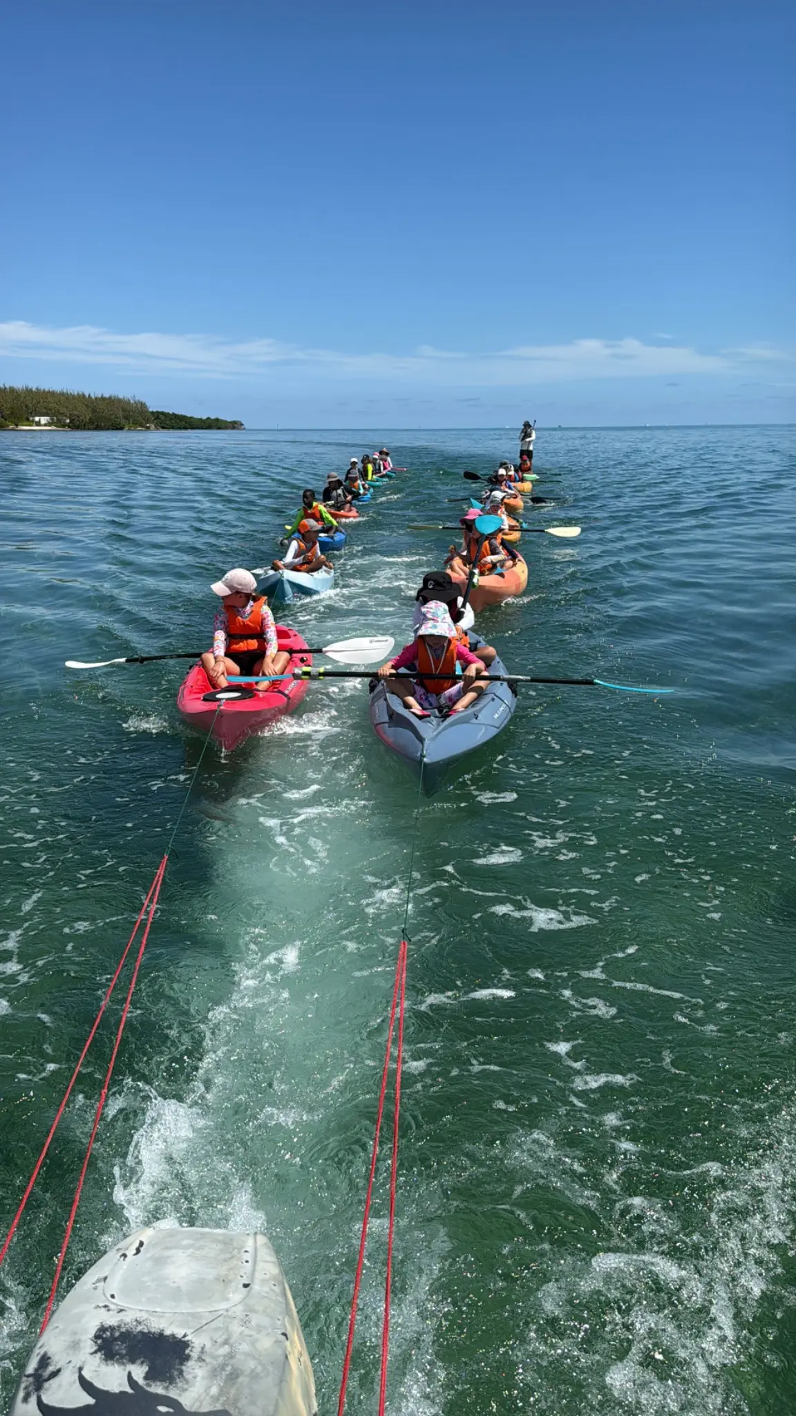 Children kayaking during a Dragon Bay school-break camp